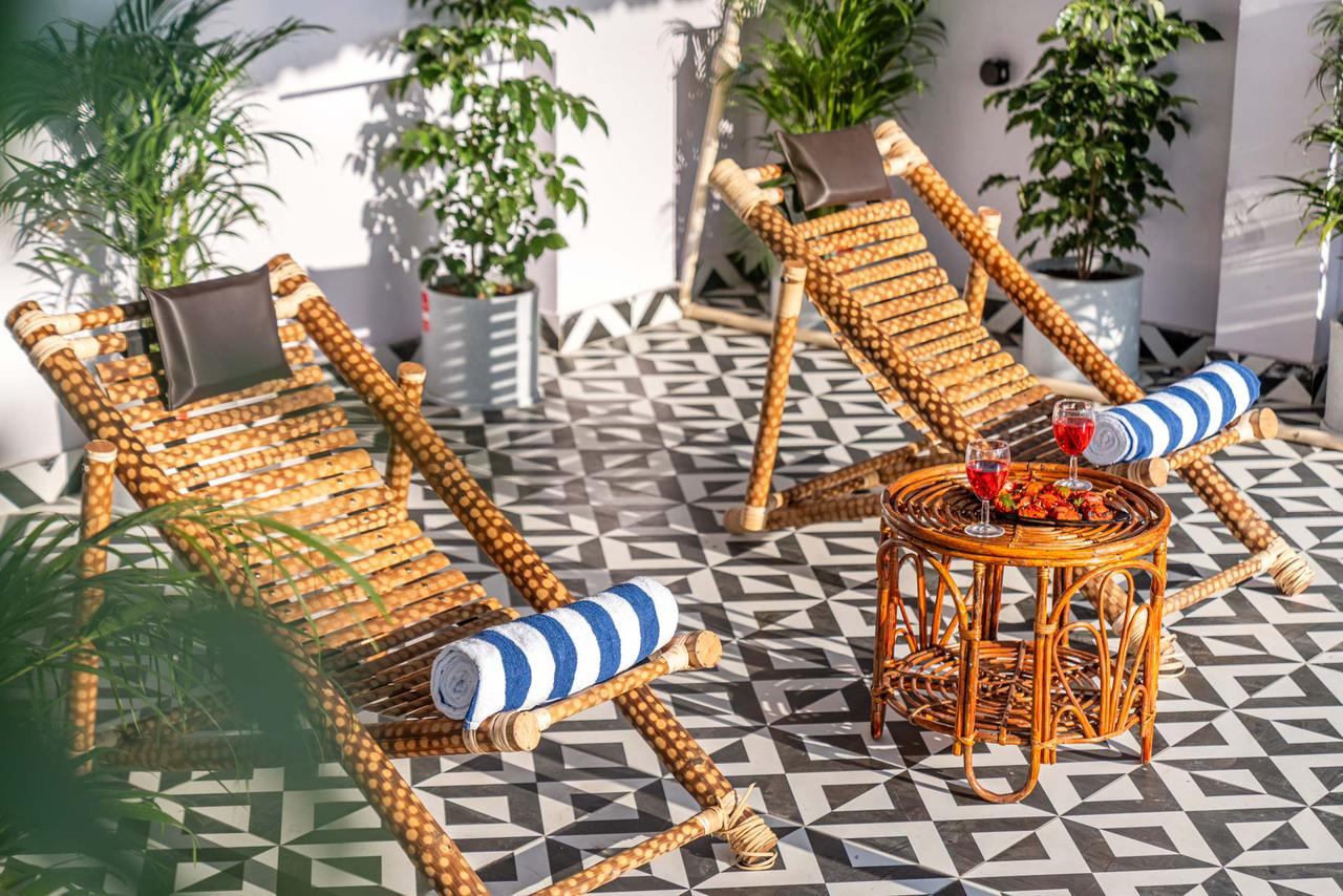 Cane loungers by the pool