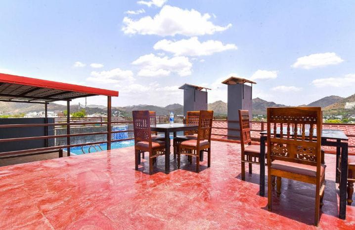 Rooftop dining terrace overlooking hills